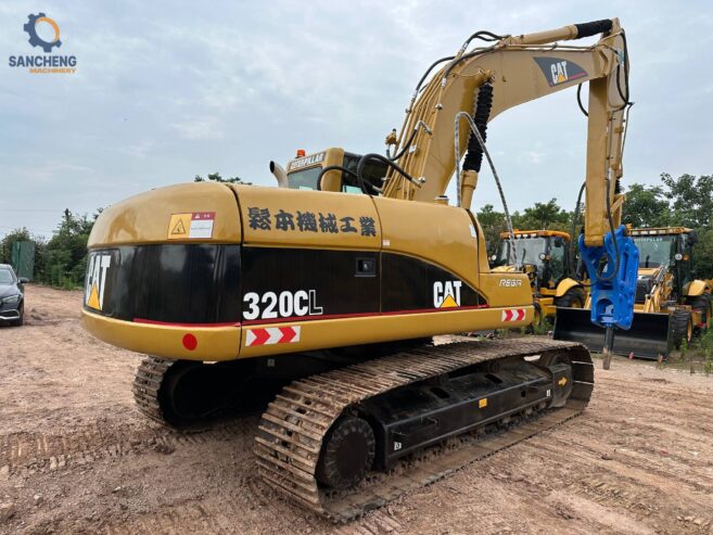 CAT 320CL crawler excavator with hammer