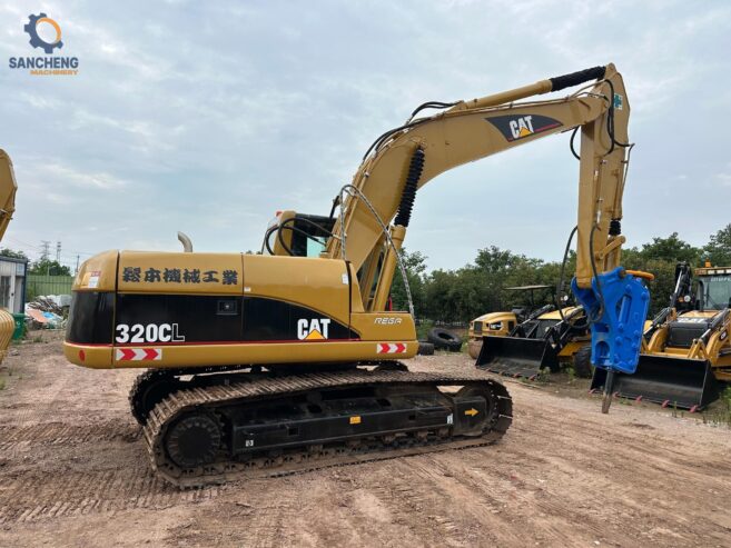 CAT 320CL crawler excavator with hammer